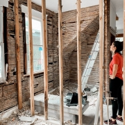 woman in the middle of a house construction
